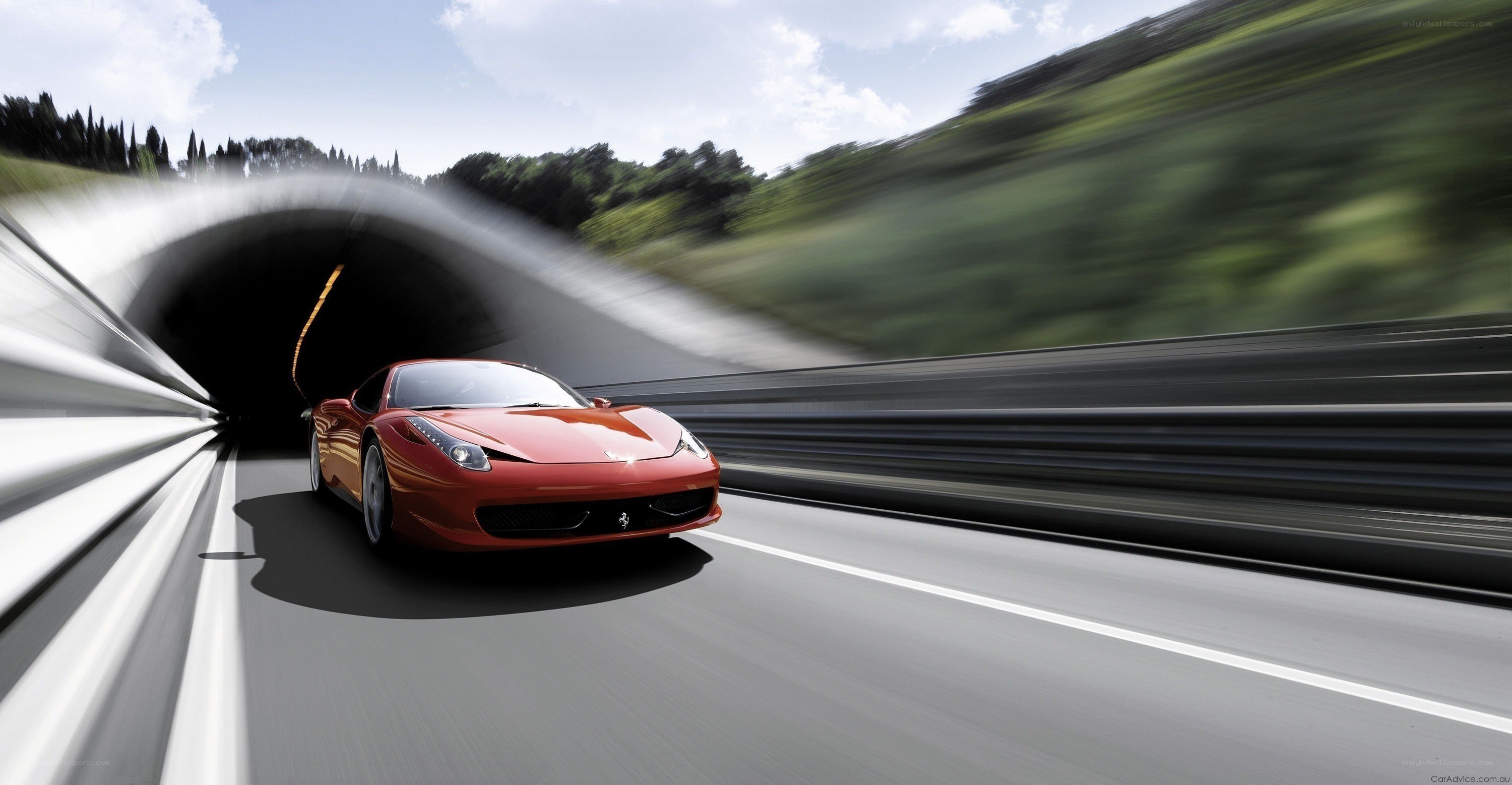 Red Ferrari exiting tunnel