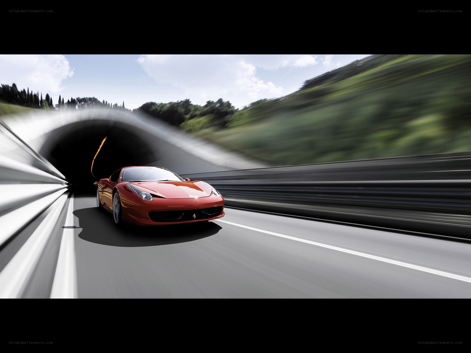 Red Ferrari exiting tunnel