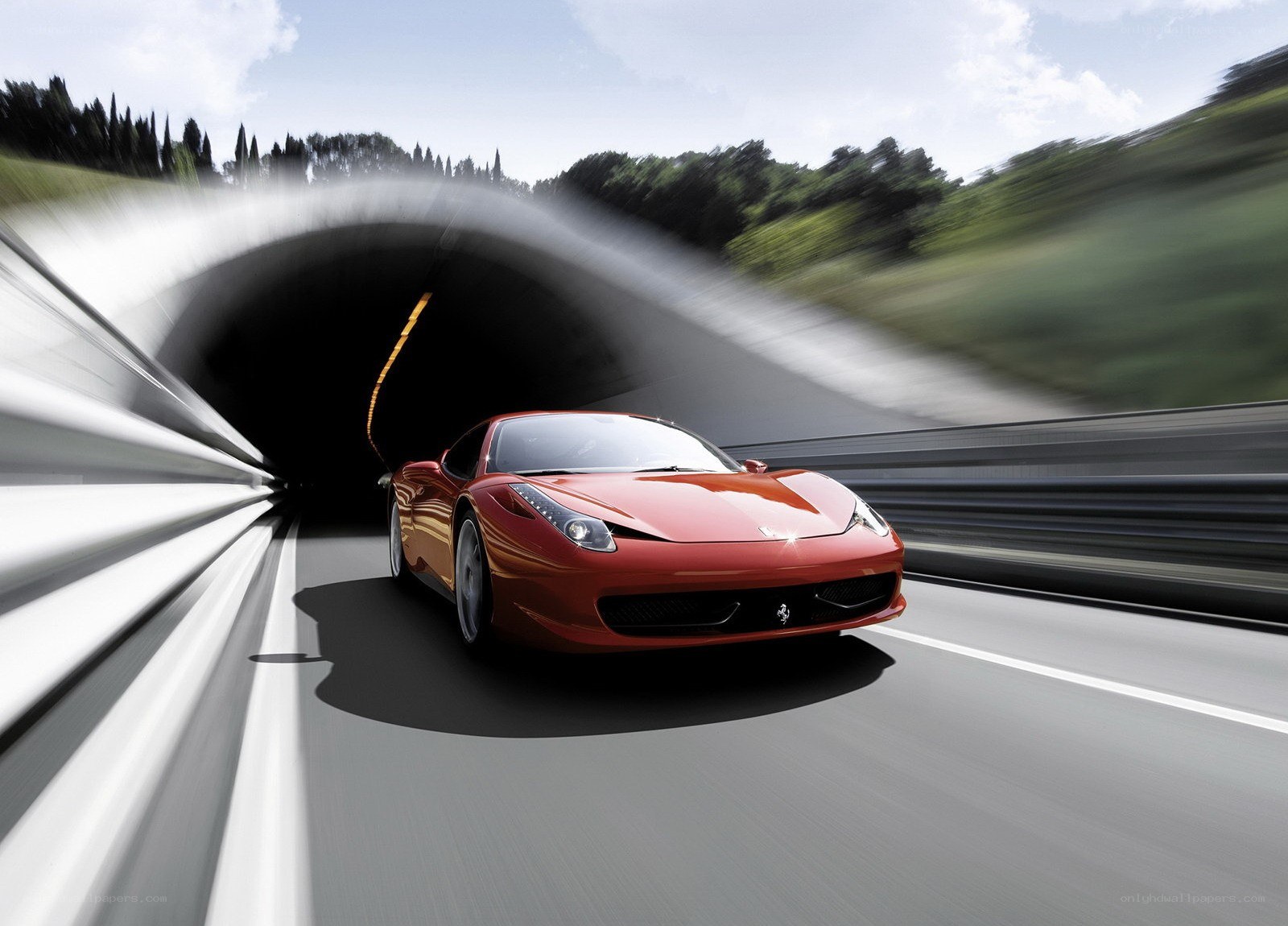 Red Ferrari exiting tunnel