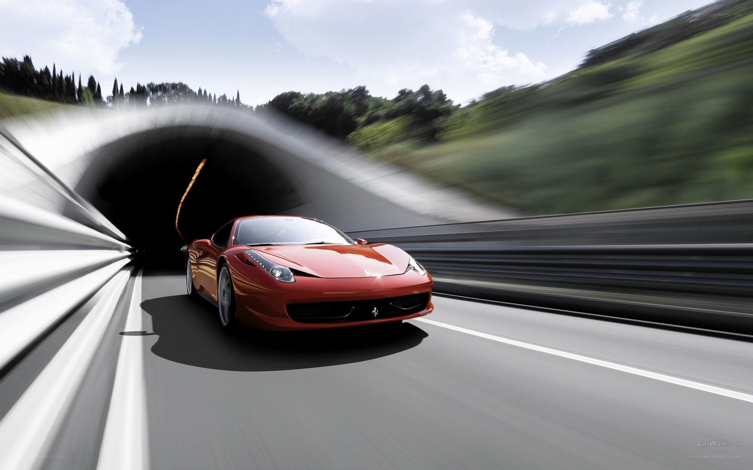 Red Ferrari exiting tunnel