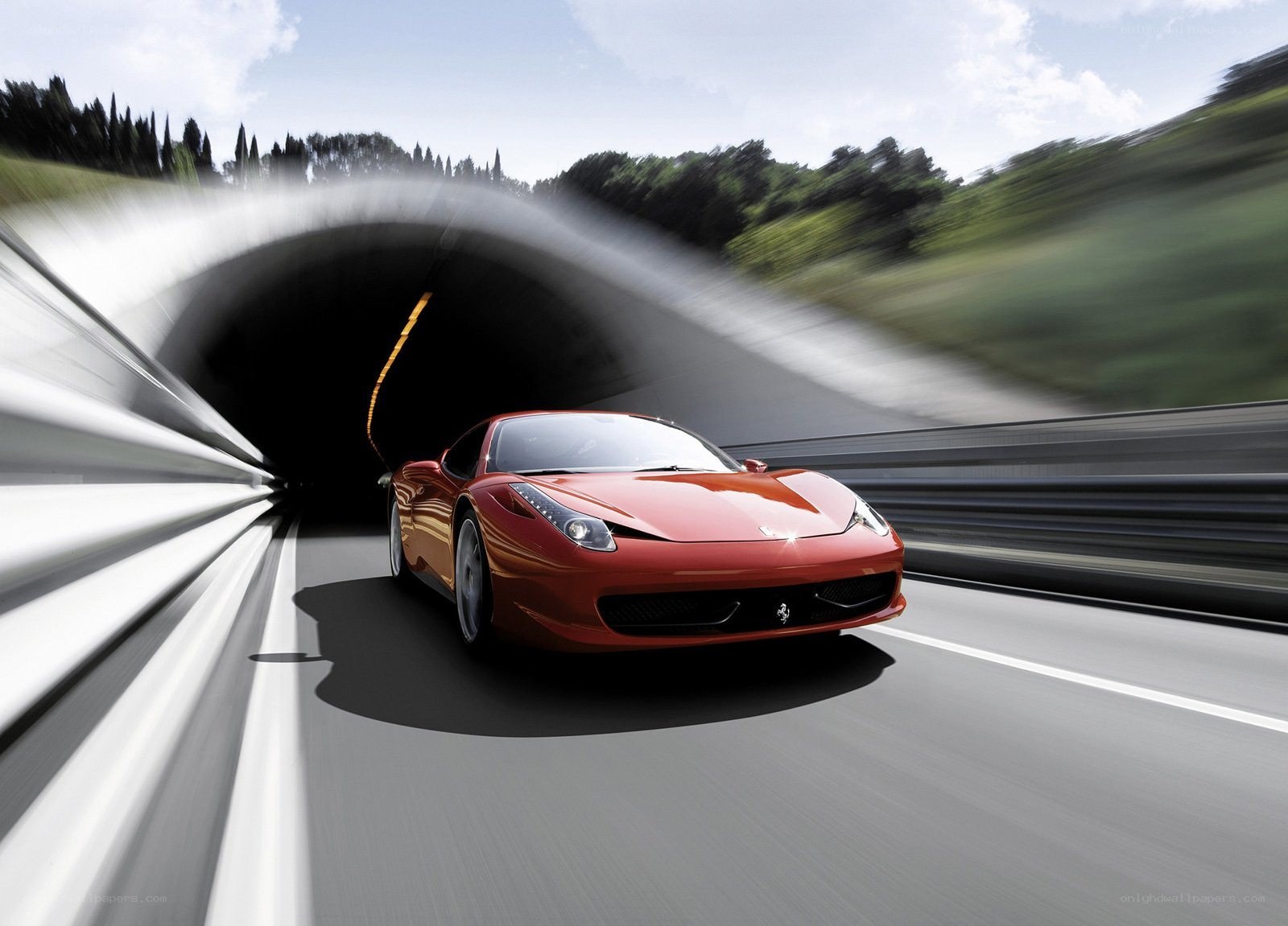 Red Ferrari exiting tunnel