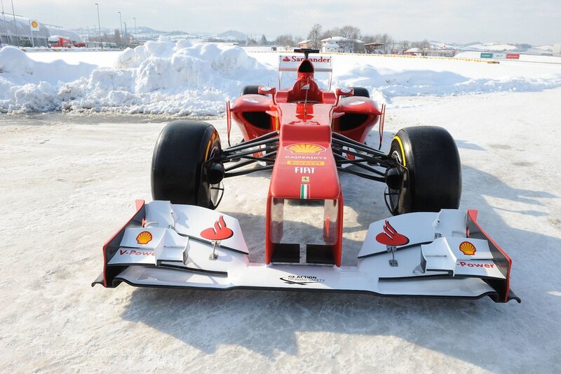 Red Ferrari F1 car on snow
