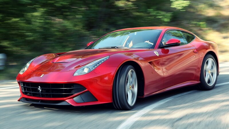 Red Ferrari F12 Berlinetta in motion