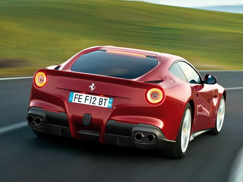 Red Ferrari F12 Berlinetta in motion