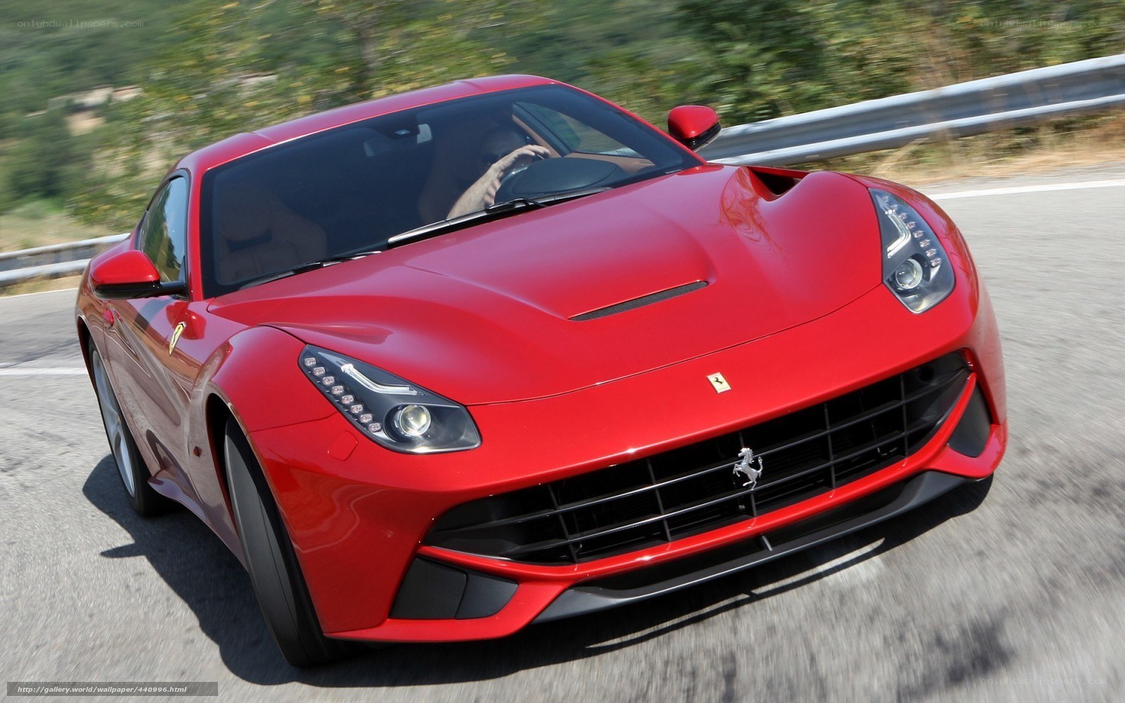 Red Ferrari F12berlinetta in motion