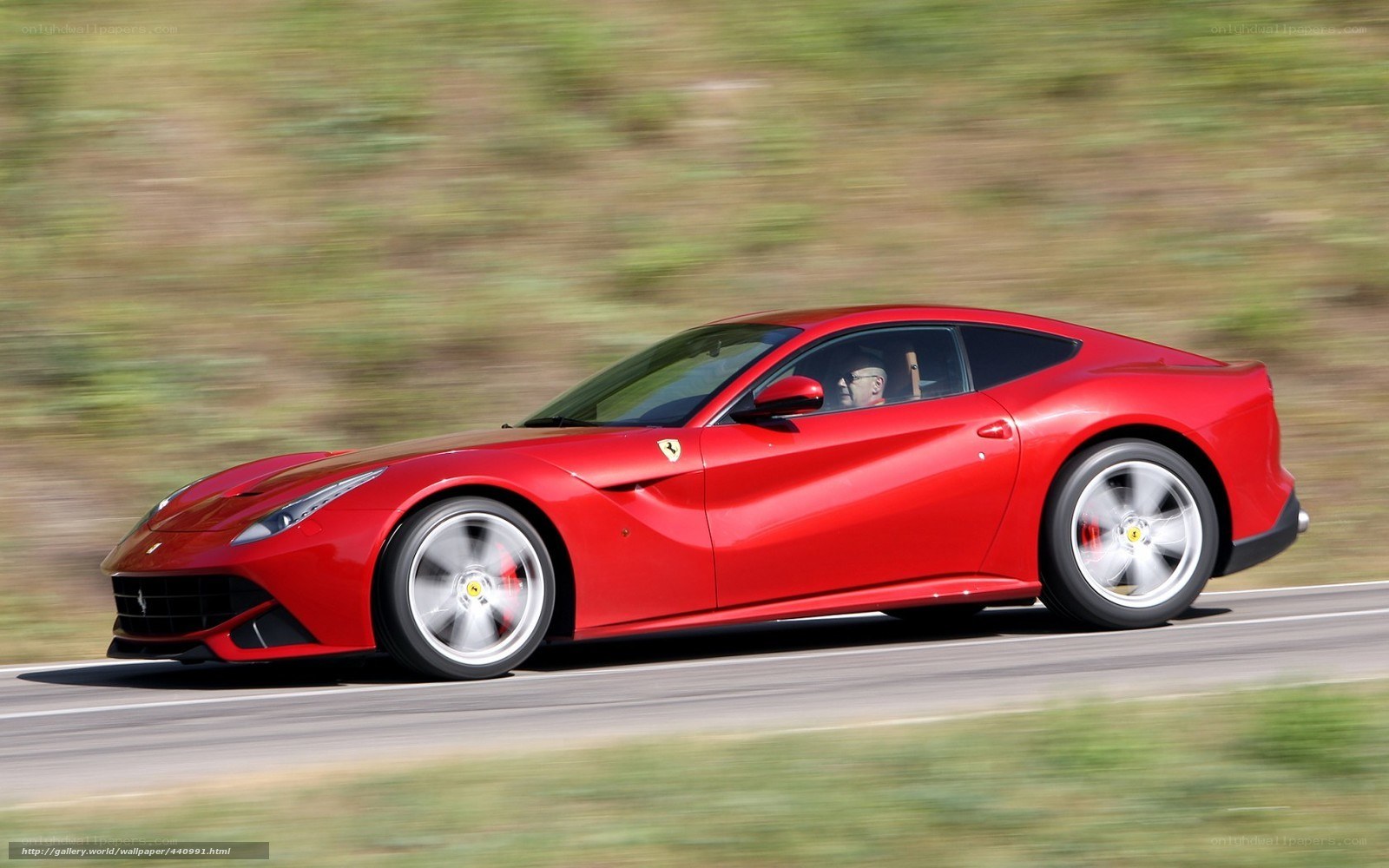 Red Ferrari F12berlinetta in motion