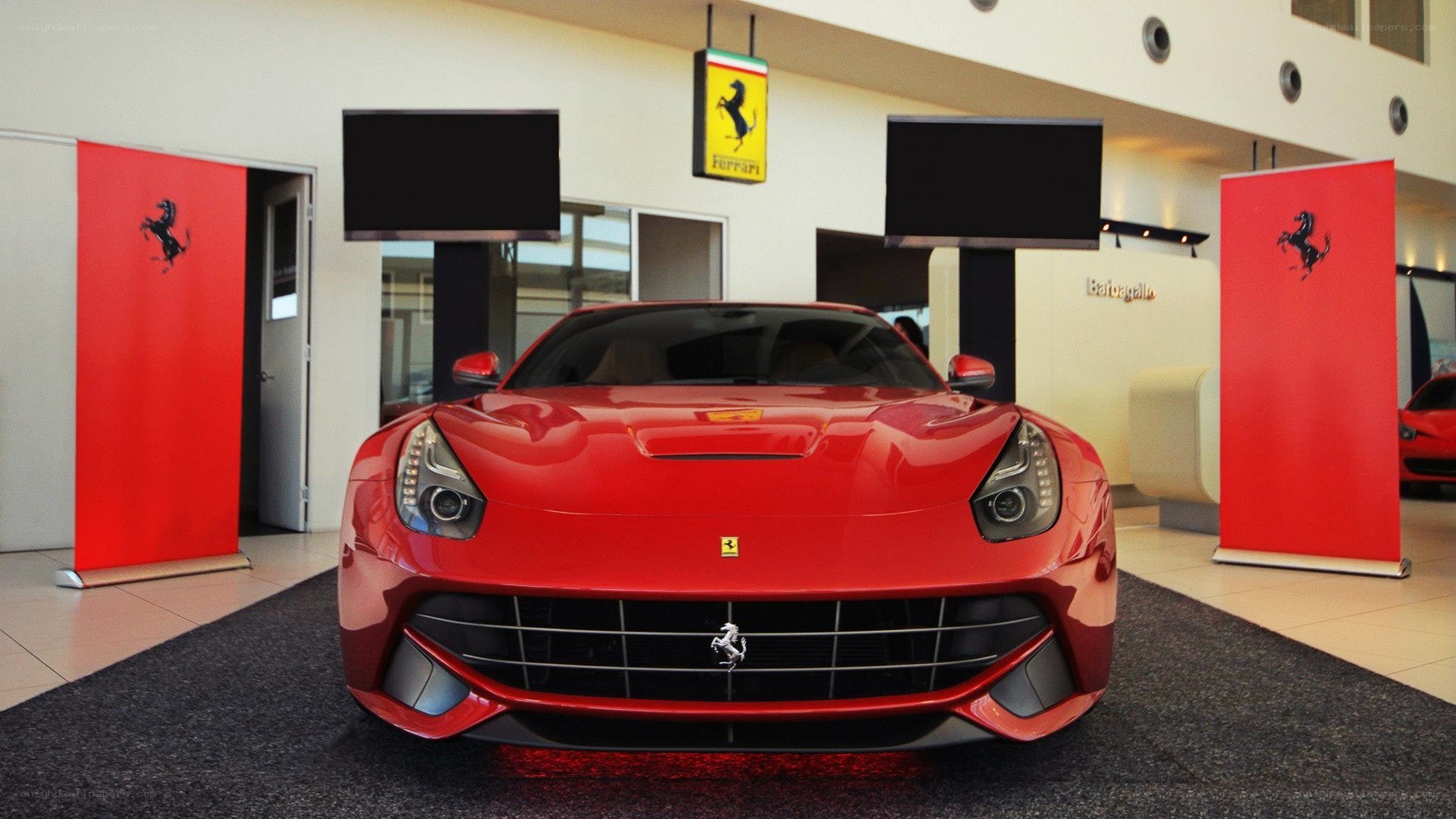 Red Ferrari F12berlinetta on display