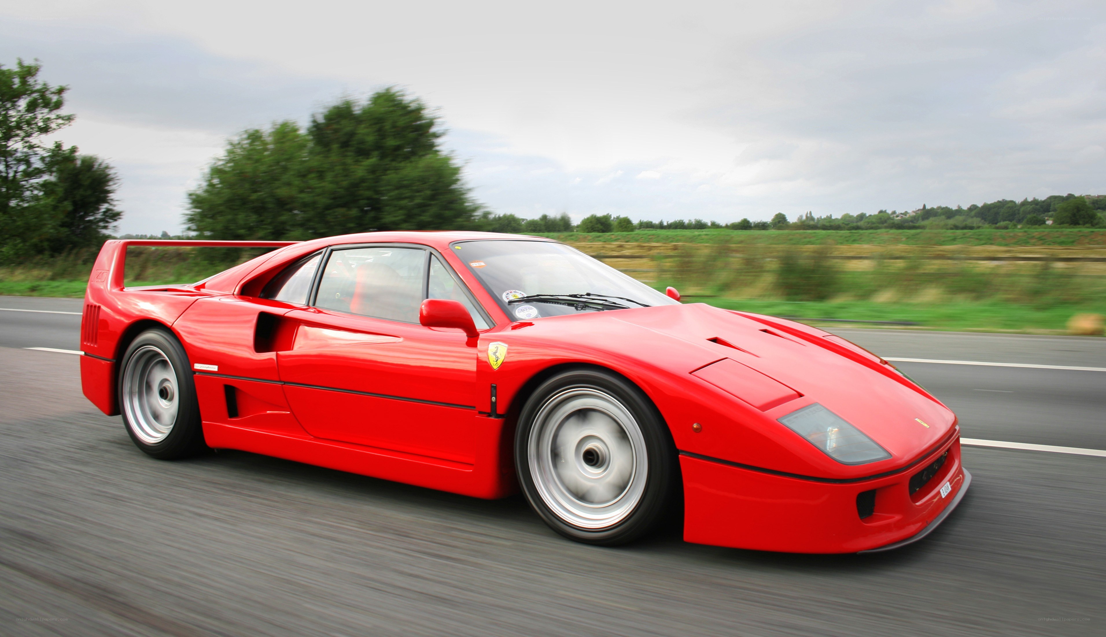 red ferrari f40 in motion