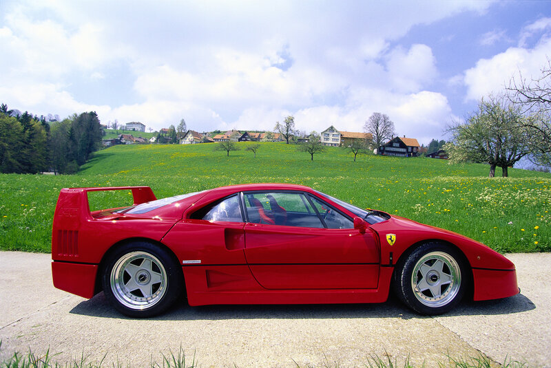 Red Ferrari F40 on a country road