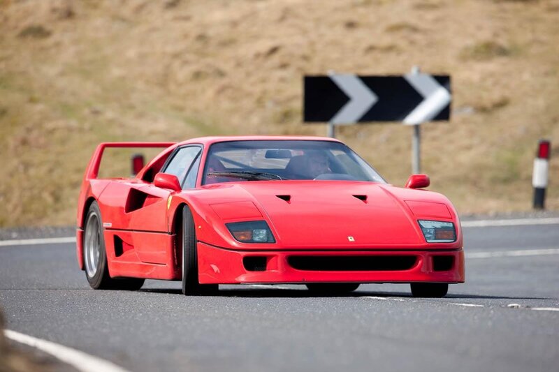 Red Ferrari F40 on a road