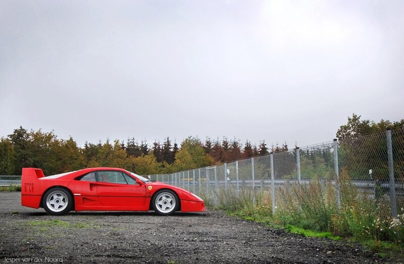 Red Ferrari F40 on gravel