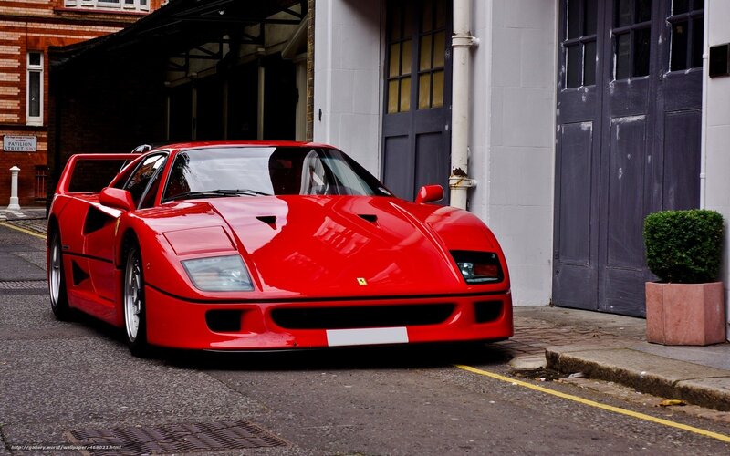 Red Ferrari F40 parked on street