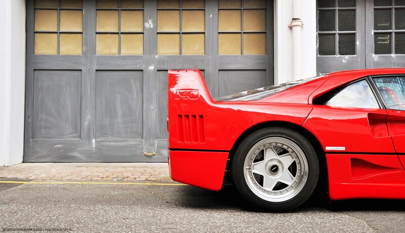 Red Ferrari F40 parked outside