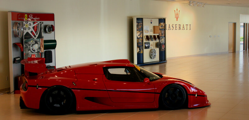 Red Ferrari F50 in showroom