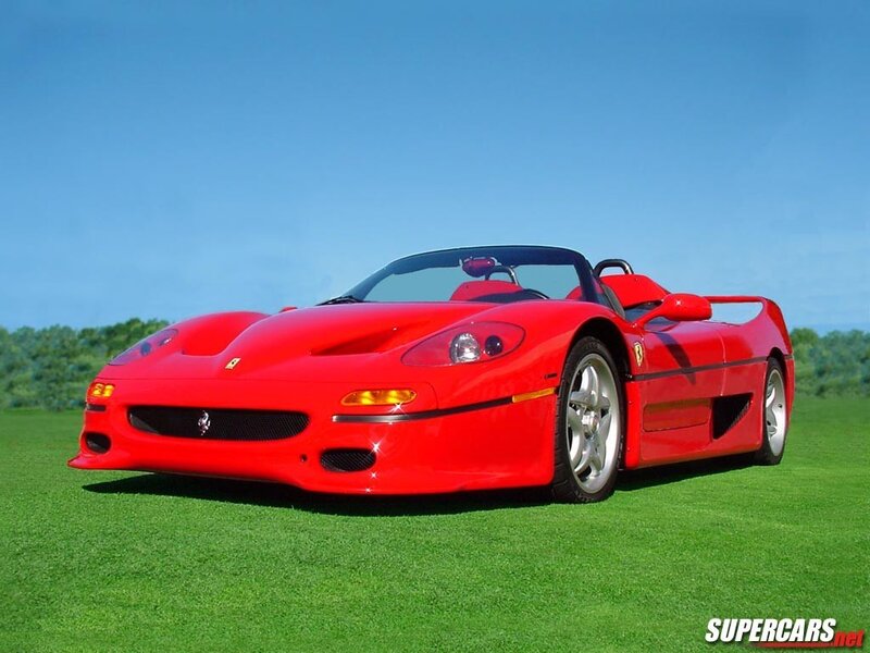 Red Ferrari F50 on a grass field