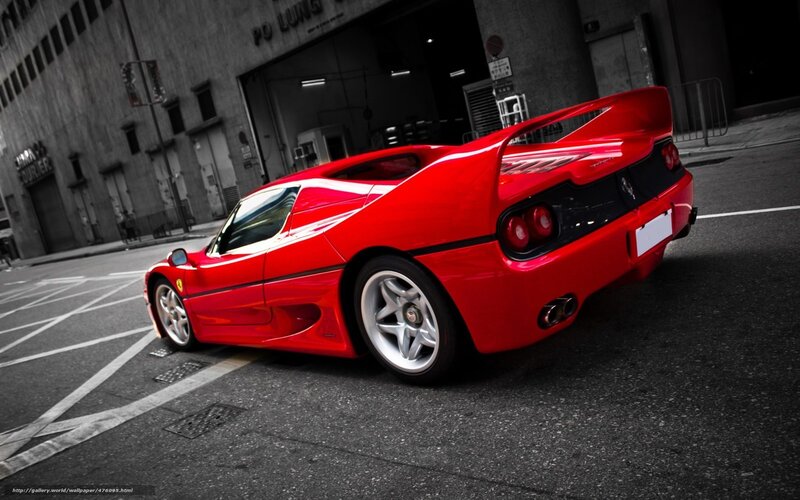 Red Ferrari F50 on city street