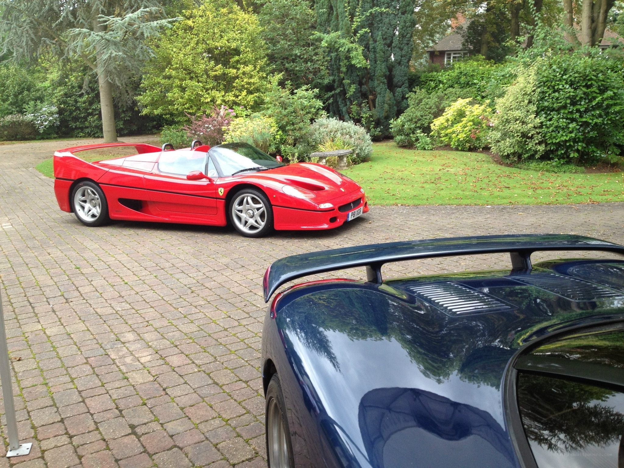 Red Ferrari F50 on driveway