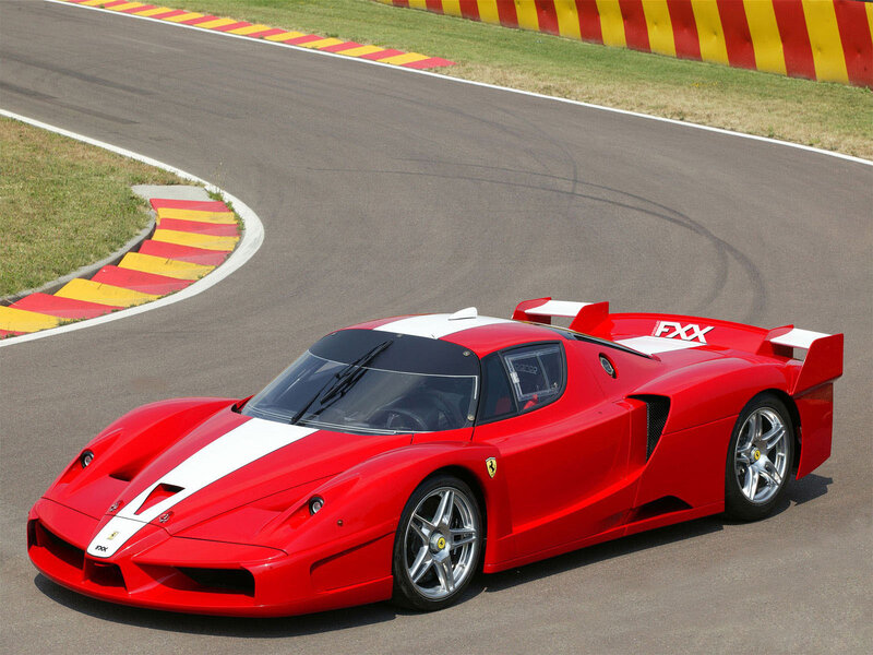 Red Ferrari FXX on racetrack