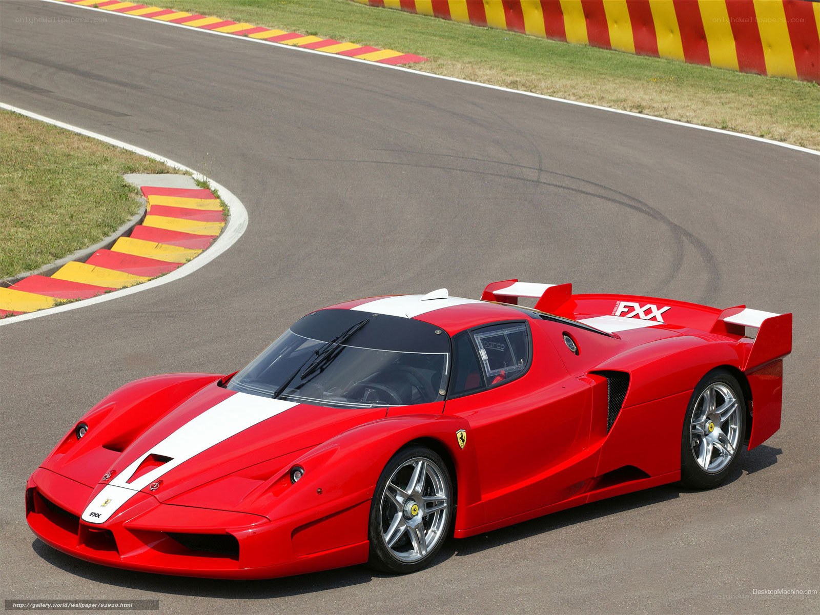 Red Ferrari FXX on racetrack