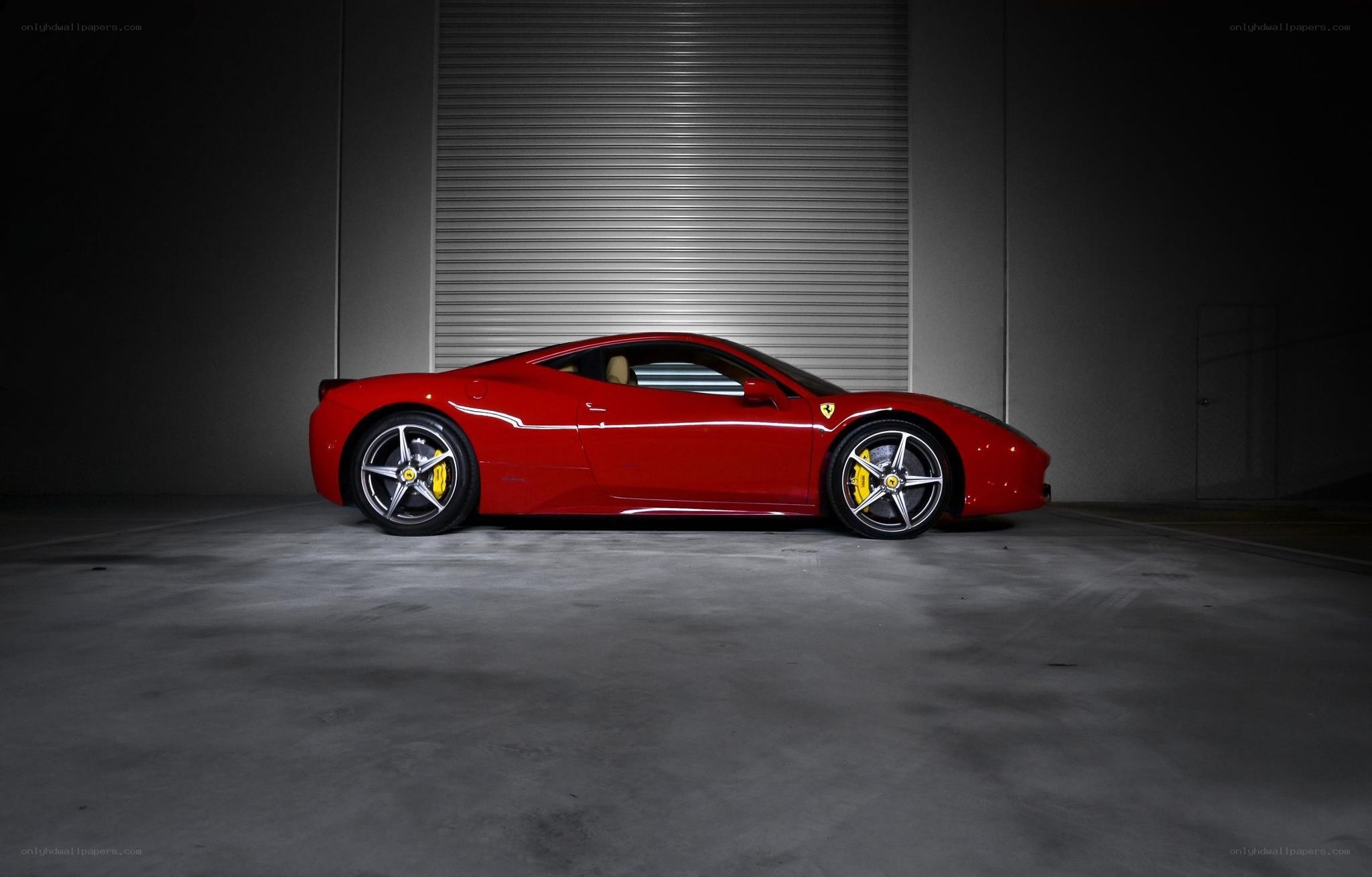 Red Ferrari in a garage