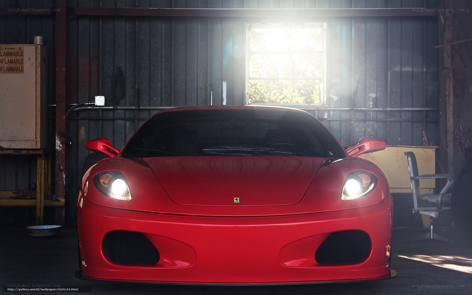 Red Ferrari in a garage