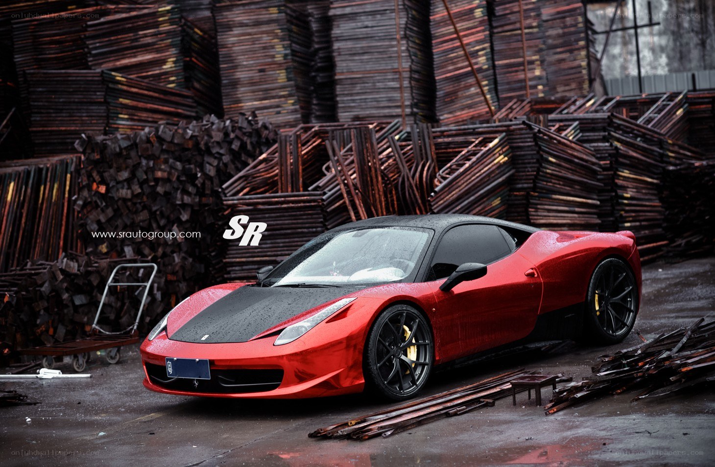 Red Ferrari in a junkyard