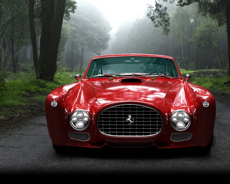 Red Ferrari in a misty forest