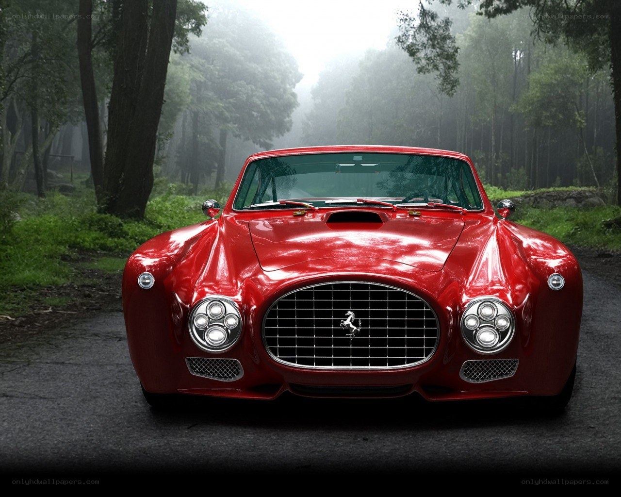 Red Ferrari in a misty forest