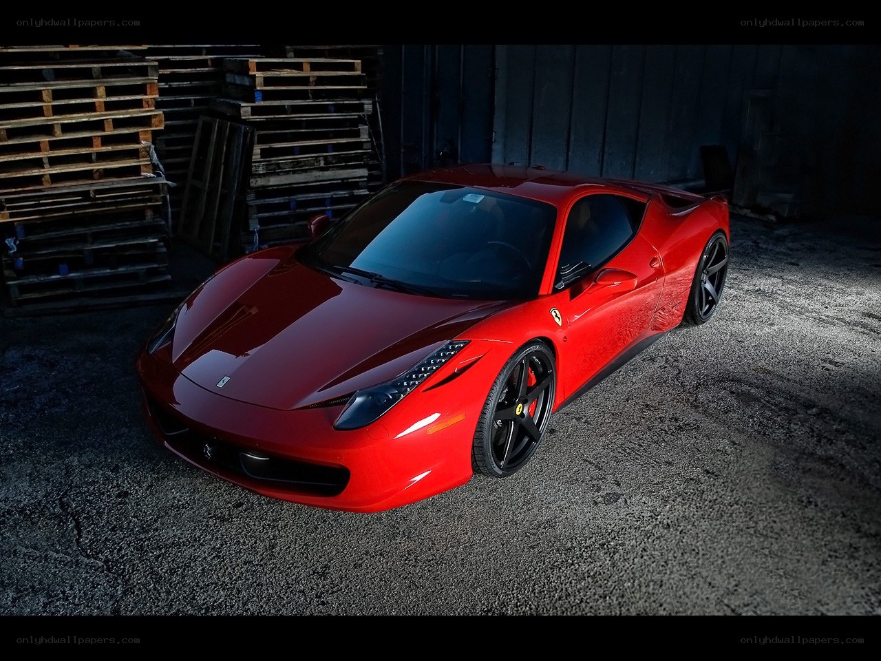 Red Ferrari in a warehouse