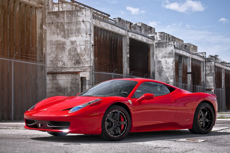 Red Ferrari in an industrial lot