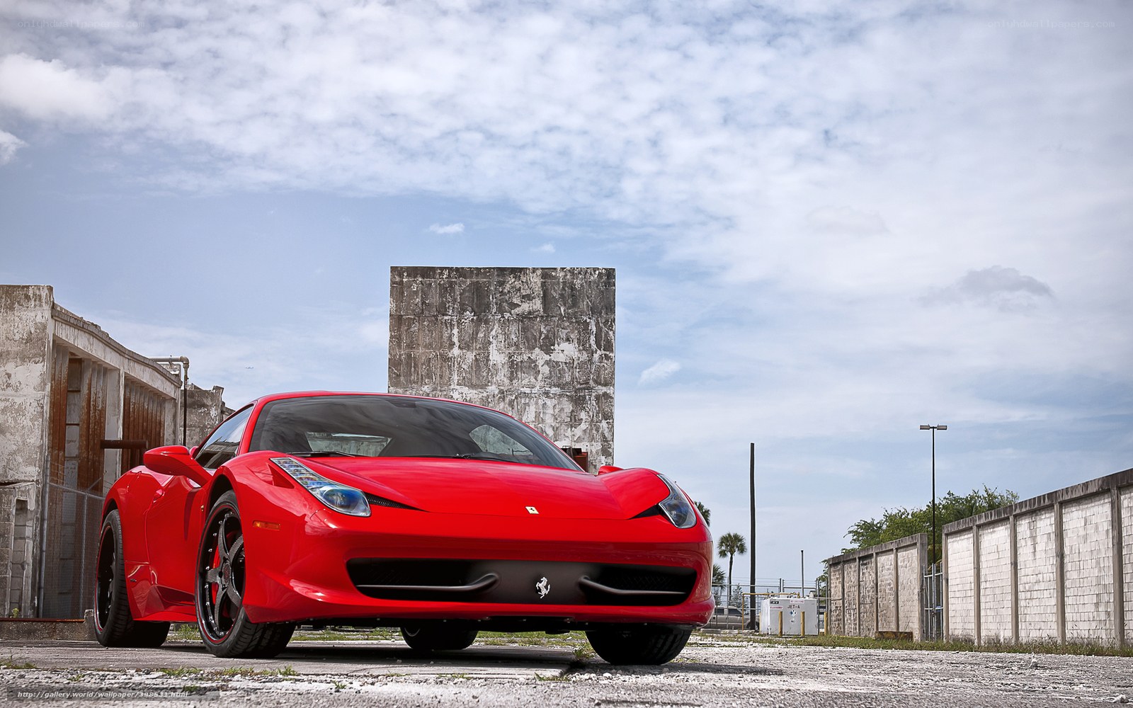 Red Ferrari in an industrial lot