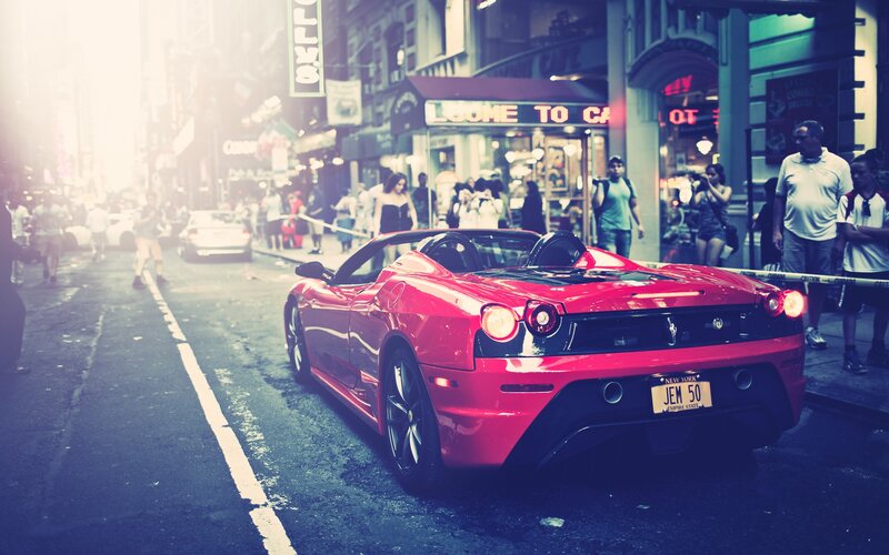 Red Ferrari in city street