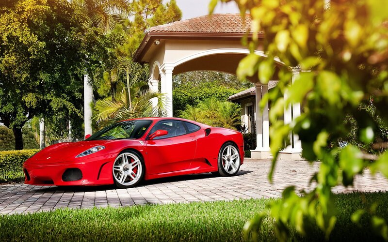 Red Ferrari in driveway