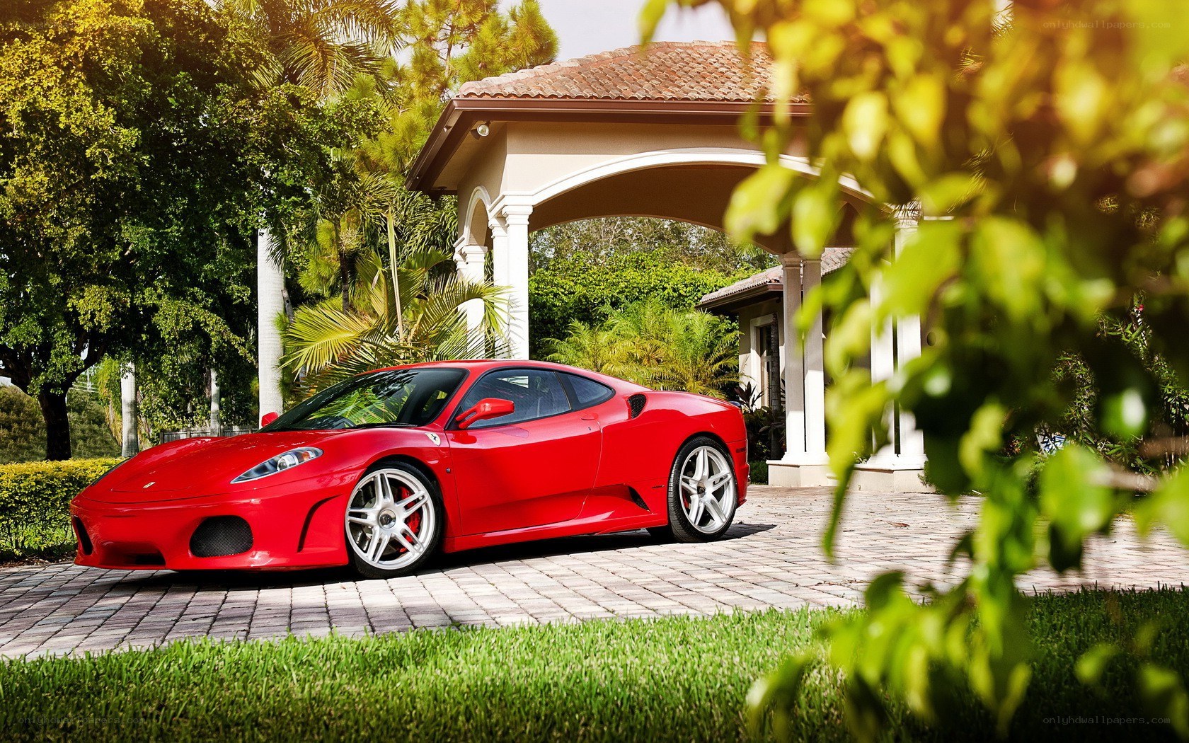Red Ferrari in driveway