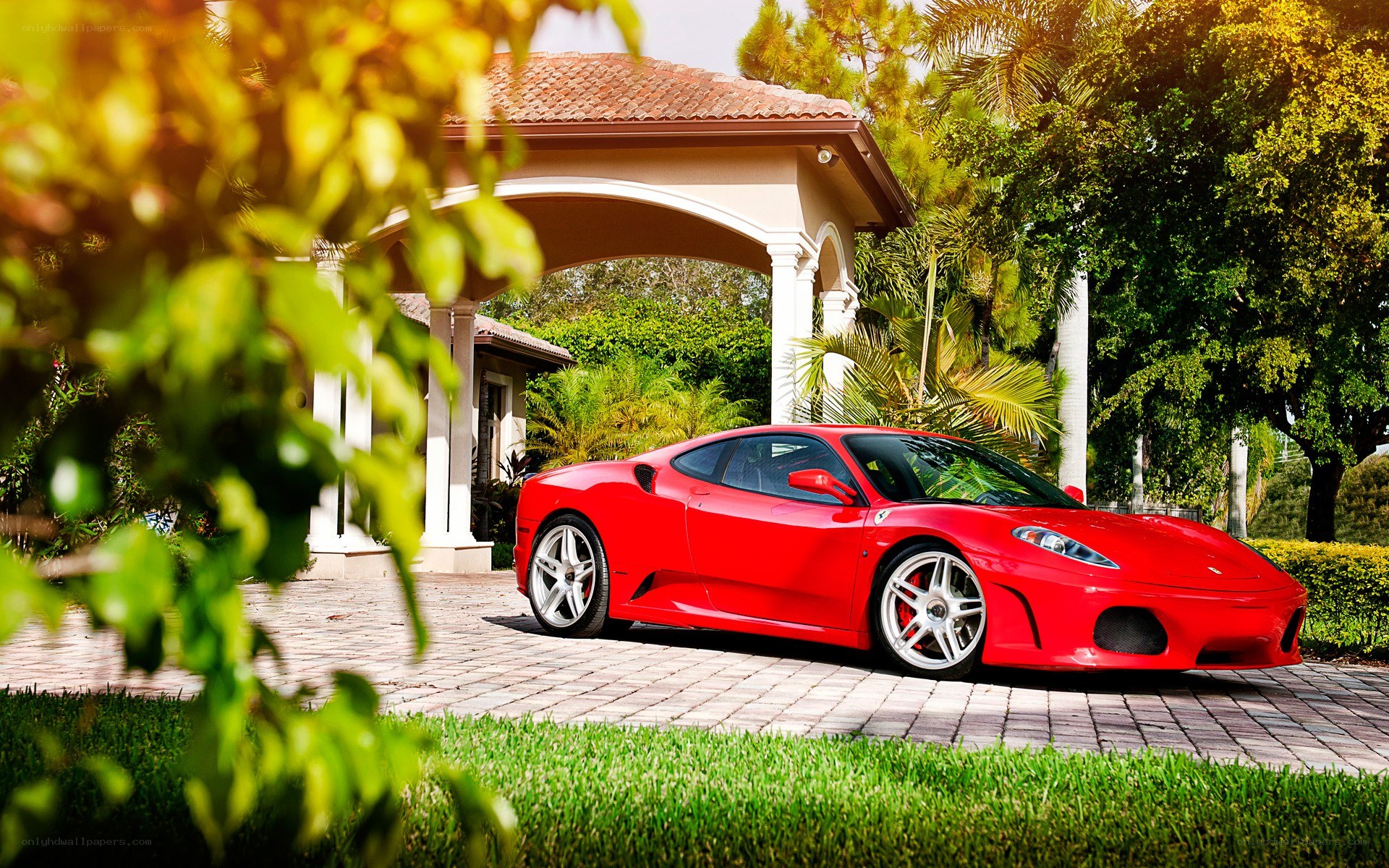 Red Ferrari in driveway