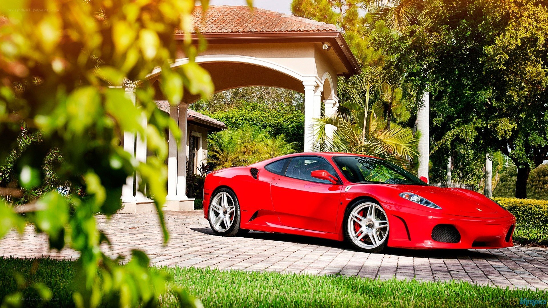 Red Ferrari in driveway