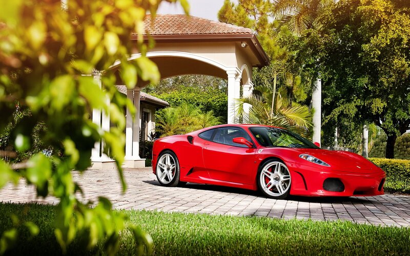 Red Ferrari in driveway
