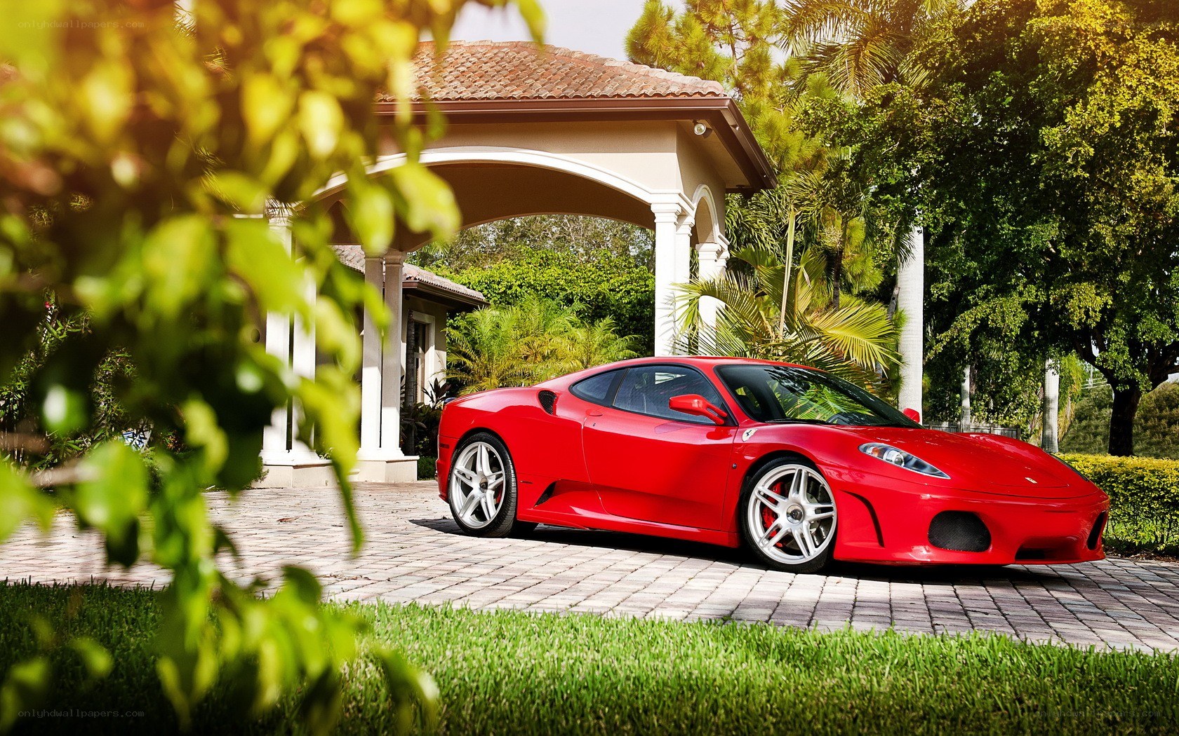 Red Ferrari in driveway