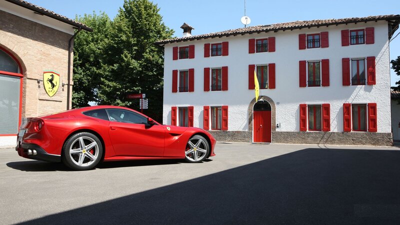 Red Ferrari in front of a building
