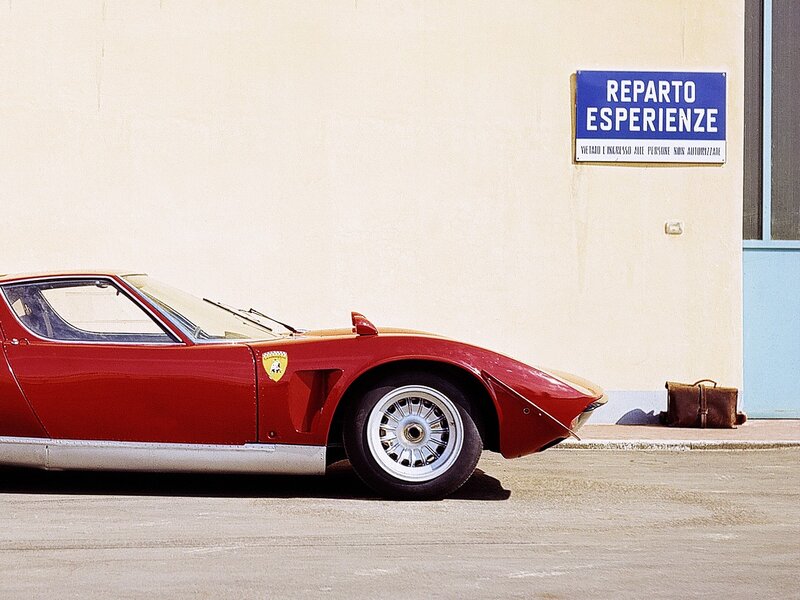 Red Ferrari in front of building