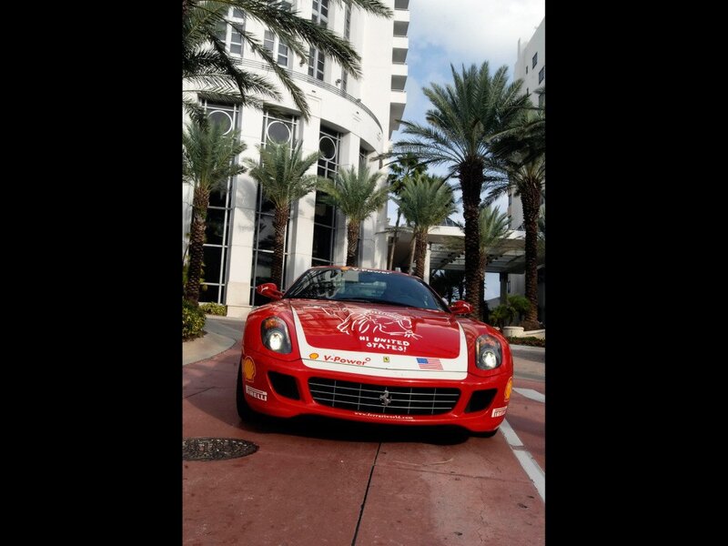 Red Ferrari in front of hotel
