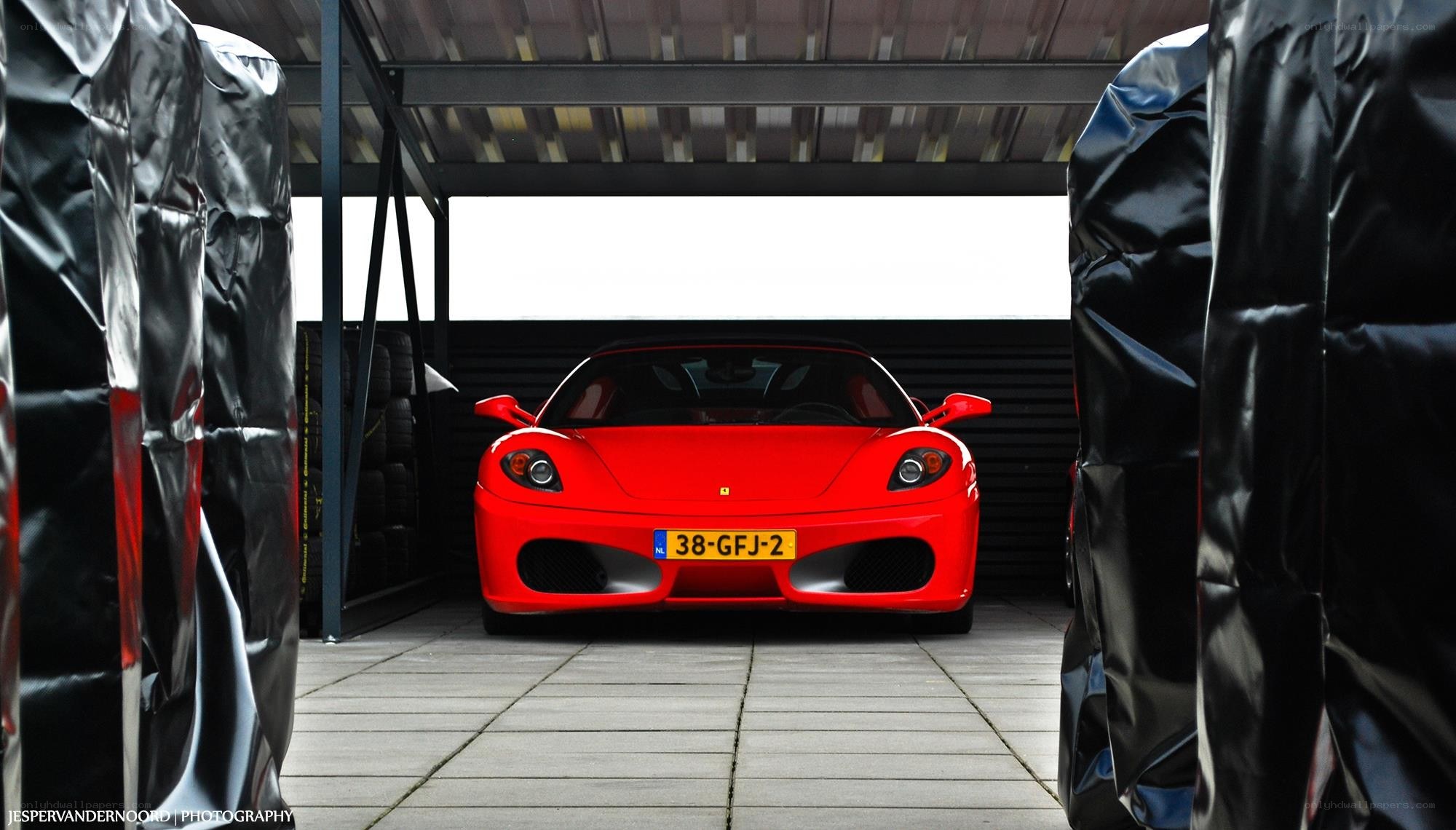 Red Ferrari in garage
