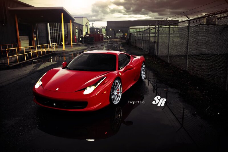Red Ferrari in industrial lot