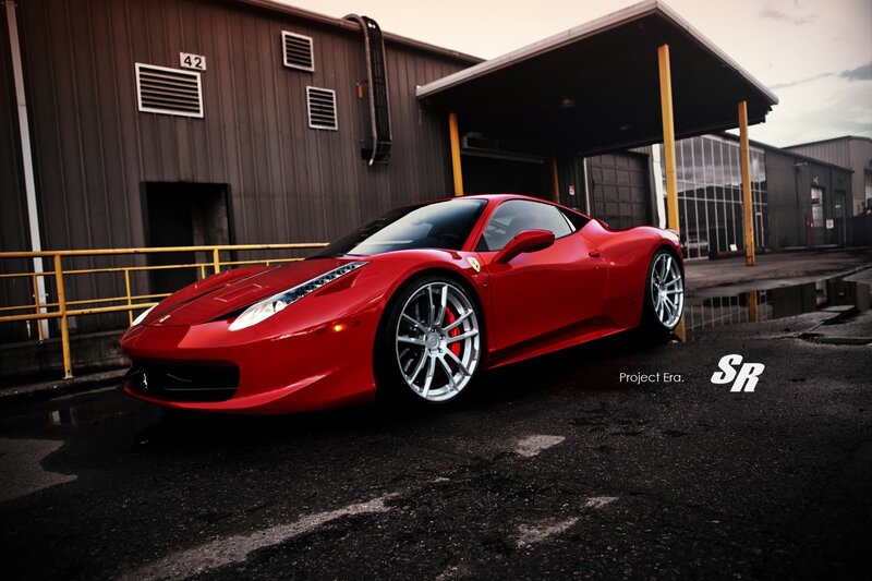 Red Ferrari in industrial lot