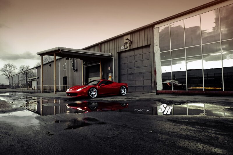Red Ferrari in industrial lot