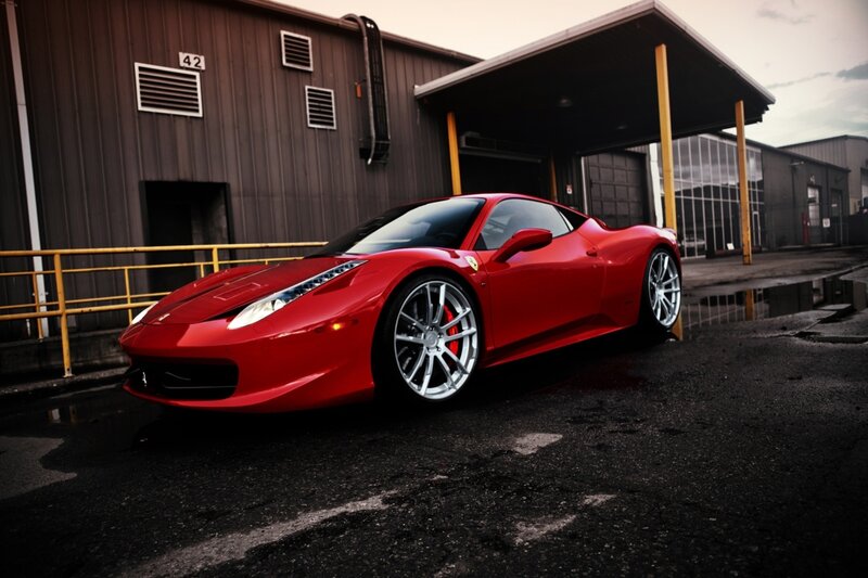 Red Ferrari in industrial lot
