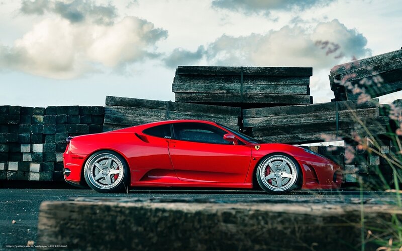 Red Ferrari in industrial setting