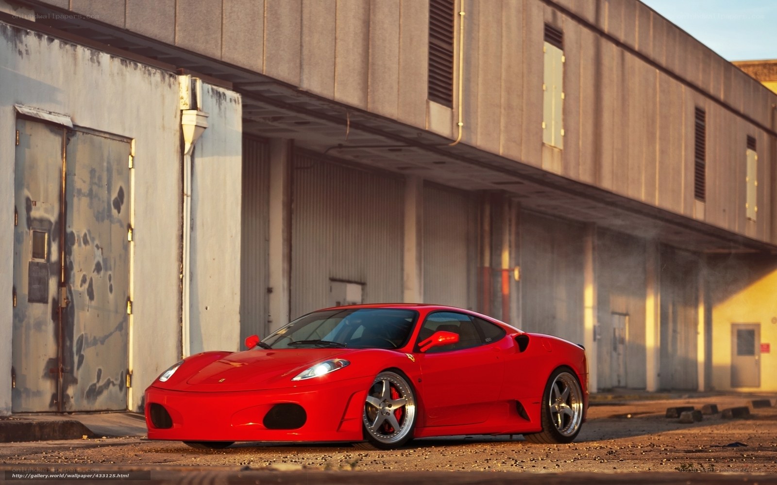 Red Ferrari in industrial setting