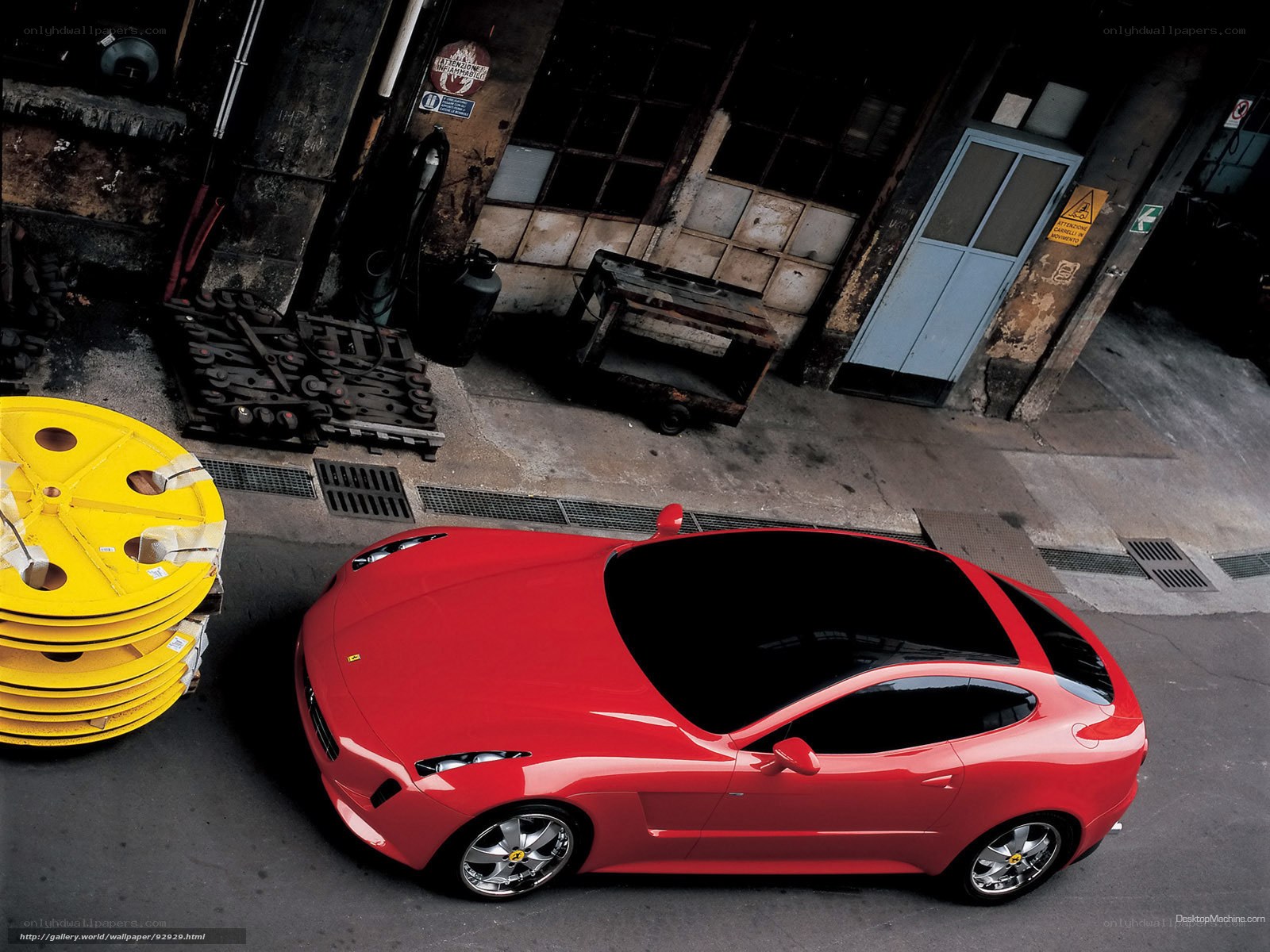 Red Ferrari in industrial setting