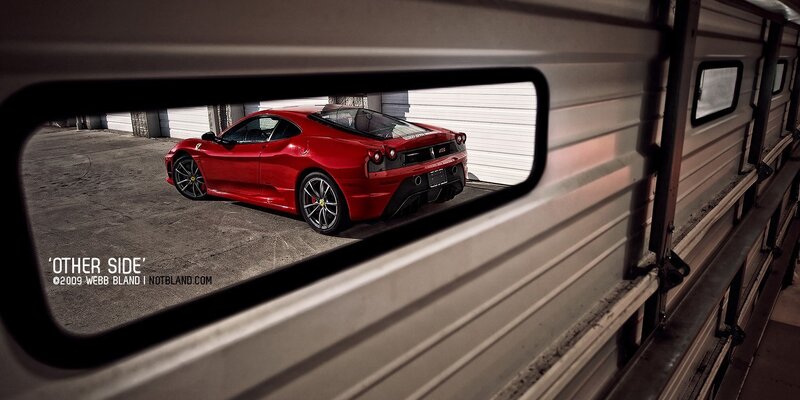 Red Ferrari in mirror reflection